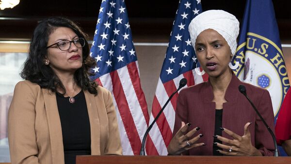 In this July 15, 2019, file photo, U.S. Rep. Ilhan Omar, D-Minn, right, speaks, as U.S. Rep. Rashida Tlaib, D-Mich. listens, during a news conference at the Capitol in Washington. - Sputnik International