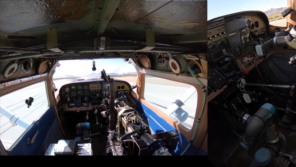 The Air Force Research Laboratory and DZYNE Technologies Incorporated's first two-hour flight using the Robotic Pilot Unmanned Conversion Program called ROBOpilot in a 1986 Cessna 206. August 9. (Screenshot via YouTube) - Sputnik International