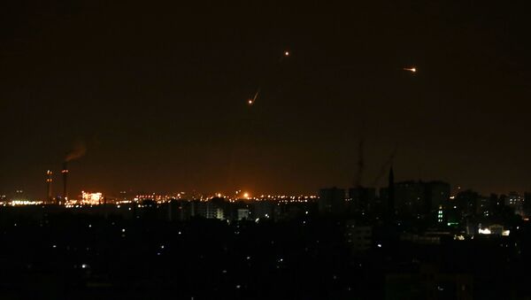 Three missile from the Iron Dome air defence system, designed to intercept and destroy incoming short-range rockets and artillery shells, from a position in the southern Israeli are seen from Gaza city on June 20, 2018.  - Sputnik International