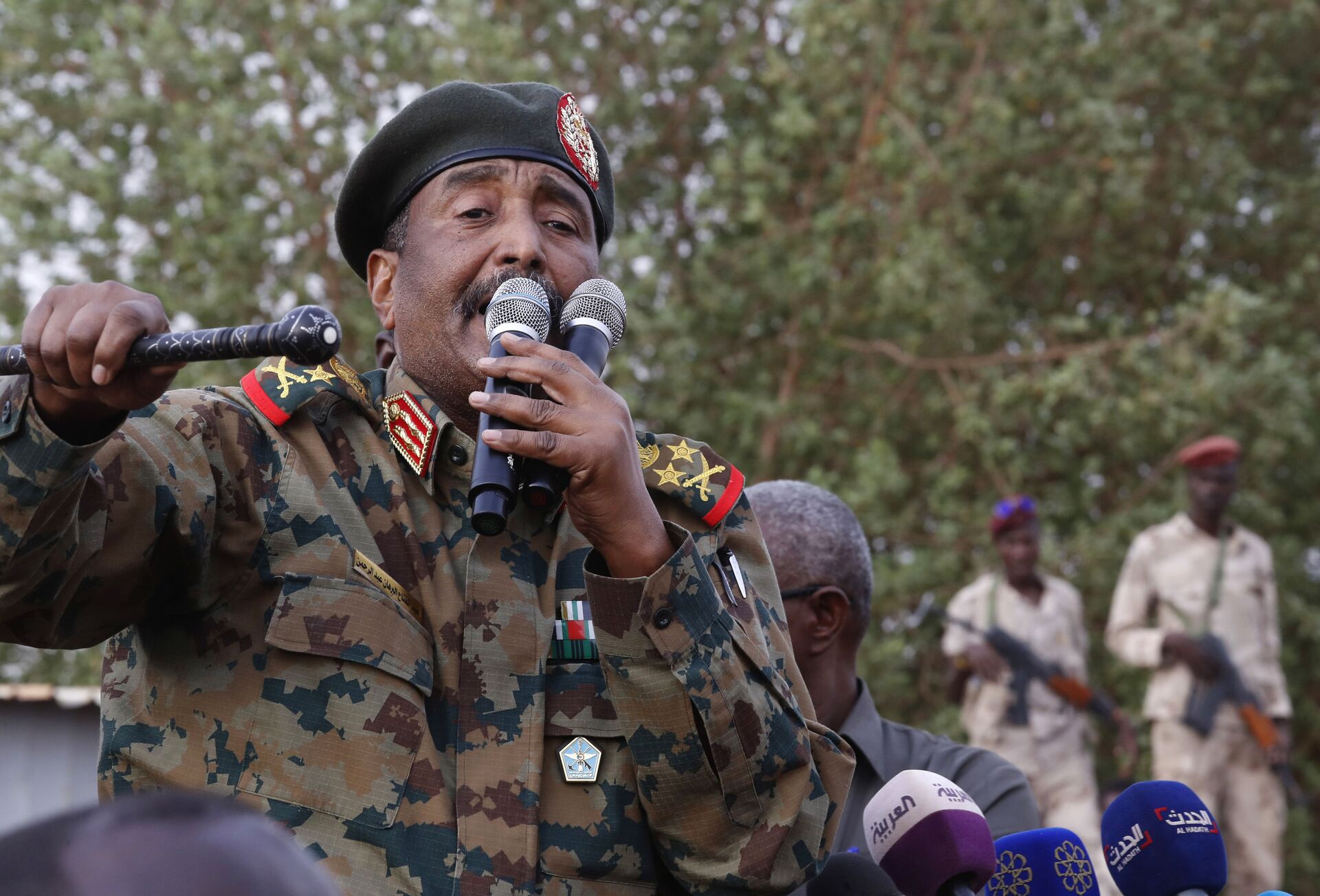 In this June 29, 2019, file photo, Sudanese Gen. Abdel-Fattah Burhan, head of the military council, speaks during a military-backed rally, in Omdurman district, west of Khartoum, Sudan. An African Union envoy says Sudan's ruling military council and the country's pro-democracy movement have reached a power-sharing agreement, including a timetable for a transition to civilian rule. Mohammed el-Hassan Labat said early Friday, July 5, that both sides agreed to form a joint sovereign council that will rule the country for three years or a little more. The sides agreed to five seats for the military and five for civilians with an additional seat going to a civilian with military background. - Sputnik International, 1920, 27.10.2021