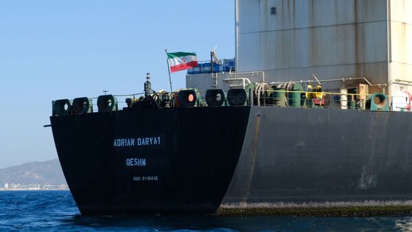 An Iranian flag flutters on board the Adrian Darya oil tanker, formerly known as Grace 1, off the coast of Gibraltar on August 18, 2019. - Gibraltar rejected a US demand to seize the Iranian oil tanker at the centre of a diplomatic dispute as it prepared to leave the British overseas territory after weeks of detention. - Sputnik International