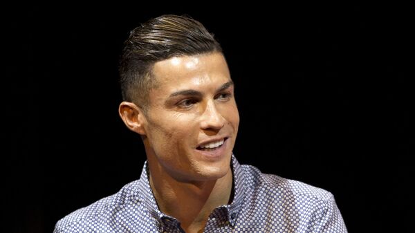 In this Monday, July 29, 2019 file photo Juventus soccer player Cristiano Ronaldo speaks in Madrid, Spain. Ronaldo's lawyers are trying to push a Nevada woman's lawsuit accusing the Portuguese soccer star of raping her in Las Vegas in 2009 out of federal court and into private arbitration. Attorneys for Ronaldo's accuser, Kathryn Mayorga, didn't immediately respond Wednesday, Aug. 14, 2019 to messages about documents filed Aug. 8. They asked a judge to declare a confidentiality agreement and $375,000 hush-money settlement with Mayorga still in effect.  - Sputnik International