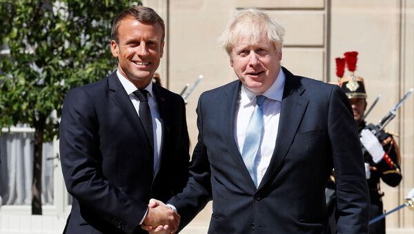 French President Emmanuel Macron welcomes British Prime Minister Boris Johnson before a meeting on Brexit at the Elysee Palace in Paris, France, August 22, 2019 - Sputnik International