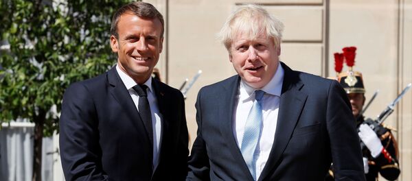 French President Emmanuel Macron welcomes British Prime Minister Boris Johnson before a meeting on Brexit at the Elysee Palace in Paris, France, August 22, 2019 - Sputnik International