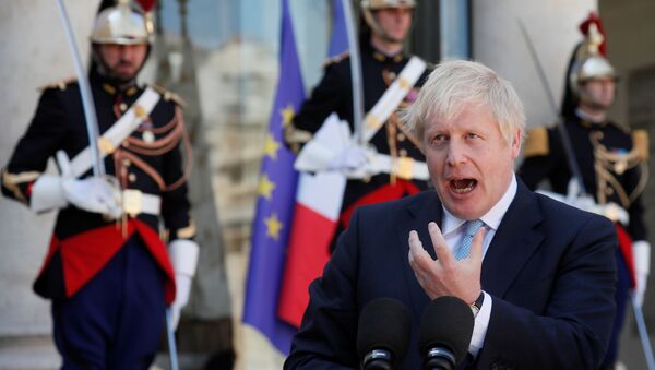 British Prime Minister Boris Johnson delivers a joint statement with French President Emmanuel Macron (not seen) before a meeting on Brexit at the Elysee Palace in Paris, France, August 22, 2019 - Sputnik International