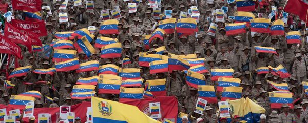 Venezuelan National Militia members and supporters of President Maduro's government rally against the blocade imposed by U.S. President Donald Trump, in Caracas, Venezuela. - Sputnik International