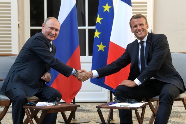 President of Russia Vladimir Putin and French President Emmanuel Macron during a meeting at the Fort de Brégançon residence on 19 August 2019. - Sputnik International