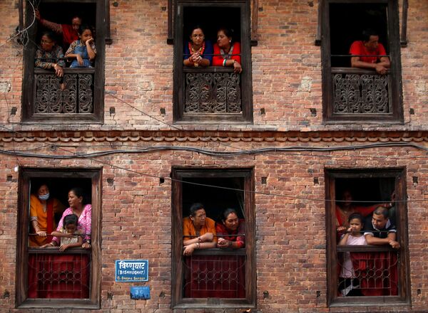 People observe the Nil Barahi mask dance festival, an annual event during which dancers perform while posing as various deities that people worship to seek blessings, in Bode, Nepal August 20, 2019.  - Sputnik International