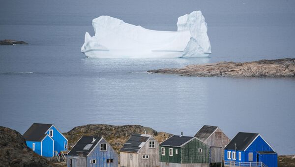 Icebergs float behind the town of Kulusuk in Greenland on August 19, 2019.  - Sputnik International
