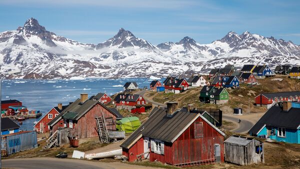 Snow covered mountains rise above the harbour and town of Tasiilaq, Greenland, June 15, 2018. - Sputnik International