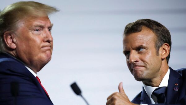 French President Emmanuel Macron and U.S. President Donald Trump react during a news conference at the end of the G7 summit in Biarritz, France - Sputnik International