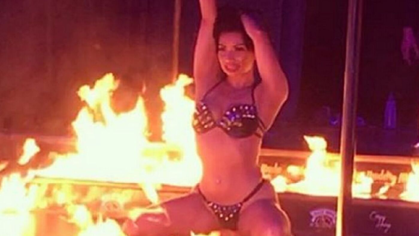 Bikini-Clad Woman in High Heels Exits Fire Truck and Enters Strip Club