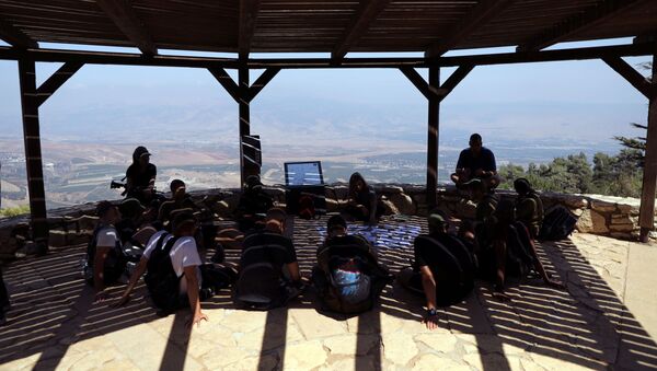 Israeli soldiers sit beneath a shade at an observation point overlooking Lebanon, near Kibbutz Misgav Am, in northern Israel, close to the border with Lebanon August 28, 2019 - Sputnik International