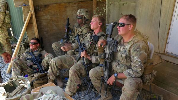 U.S. military advisers from the 1st Security Force Assistance Brigade sit at an Afghan National Army base in Maidan Wardak province, Afghanistan August 6, 2018 - Sputnik International