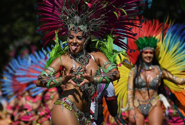 Performers in costumes take part in the carnival on the main Parade day of the Notting Hill Carnival in west London on August 26, 2019. Performers in costumes take part in the carnival on the main Parade day of the Notting Hill Carnival in west London on August 26, 2019. - Sputnik International