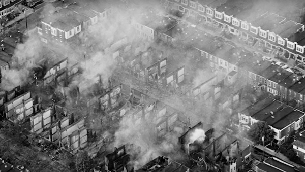 Photo of charred houses following the 1985 bombing of MOVE headquarters/home - Sputnik International