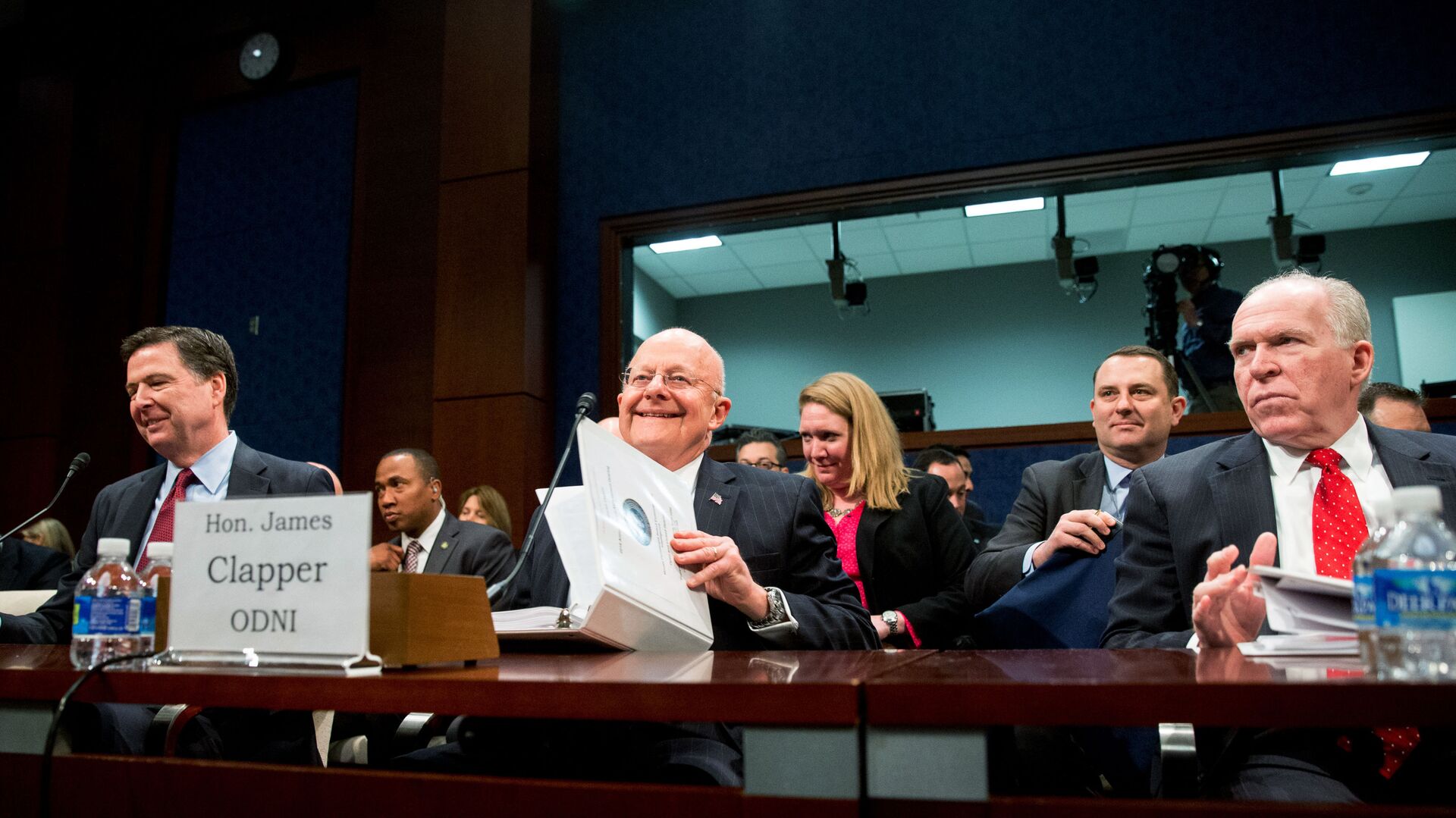 From left, then-FBI Director James Comey, then-Director of National Intelligence James Clapper, and then-CIA Director John Brennan arrive at a House Intelligence Committee hearing on world wide threats on Capitol Hill in Washington, Thursday, Feb. 25, 2016. - Sputnik International, 1920, 26.05.2022