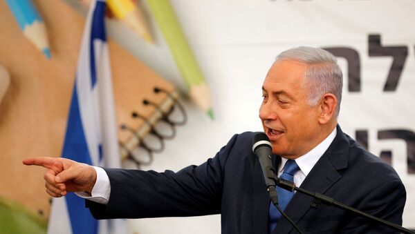 Israeli Prime Minister Benjamin Netanyahu gestures as he speaks during a ceremony opening the school year in the Jewish settlement of Elkana in the Israeli-occupied West Bank September 1, 2019. - Sputnik International