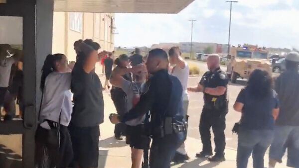 People are evacuated from Cinergy Odessa cinema following a shooting in Odessa, Texas, U.S. in this still image taken from a social media video August 31, 2019. - Sputnik International