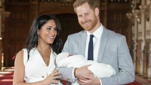 Britain's Prince Harry and Meghan, Duchess of Sussex, during a photocall with their newborn son, in St George's Hall at Windsor Castle, Windsor, south England, Wednesday May 8, 2019 - Sputnik International