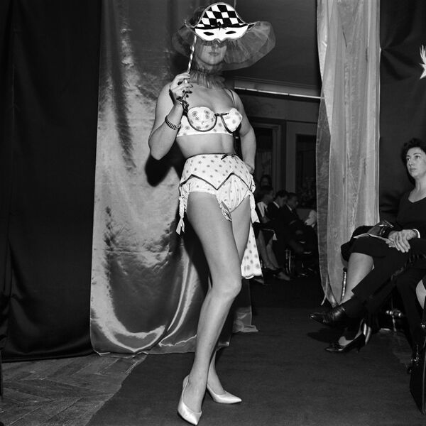 Picture released in October 1961 of a Harlequin model showcasing lingerie by the French brand Charmereine in Paris. - Sputnik International
