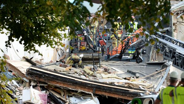 Emergency crews search at the site of an explosion, which destroyed a number of houses on the outskirts of the port city of Antwerp, Belgium, Septmeber 3, 2019 - Sputnik International