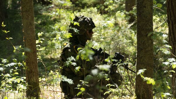 Estonian soldiers take part in an annual military exercise together with several units from other NATO member states on May 18, 2014 near Voru close to the Estonian-Russian border in South Estonia. - Sputnik International