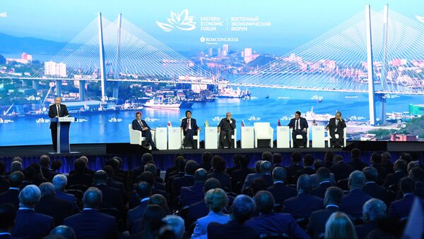 Russian President Vladimir Putin opens a plenary session of Eastern Economic Forum at far-eastern Russian port of Vladivostok on September 5, 2019 - Sputnik International