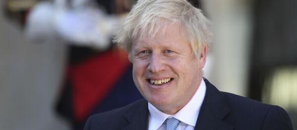 Britain's Prime Minister Boris Johnson smiles after being greeted by French President Emmanuel Macron at the Elysee Palace, Thursday, Aug. 22, 2019 in Paris - Sputnik International