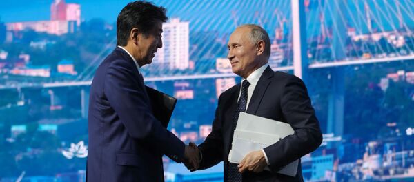 Russian President Vladimir Putin shakes hands with Japanese Prime Minister Shinzo Abe after a plenary session of the Eastern Economic Forum in Vladivostok, Russia September 5, 2019 Russian President Vladimir Putin shakes hands with Japanese Prime Minister Shinzo Abe after a plenary session of the Eastern Economic Forum in Vladivostok, Russia September 5, 2019 - Sputnik International