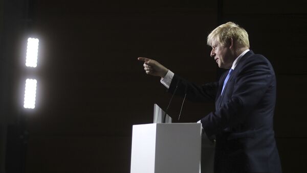 Britain's Prime Minister Boris Johnson gestures as he speaks during a press conference on the third and final day of the G-7 summit in Biarritz, France Monday, Aug. 26, 2019 - Sputnik International