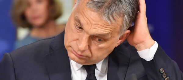 Hungary's Prime Minister Victor Orban addresses a press conference at the end of a European People's Party (EPP) meeting at the European Parliament in Brussels on March 20, 2019 - Sputnik International
