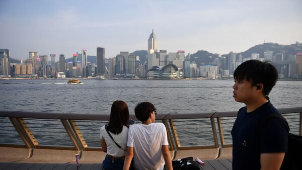 Visitors look at the view along Victoria Harbour in Hong Kong on August 22, 2019. - Sputnik International