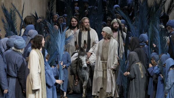FILE - In this May 10, 2010 file photo Andreas Richter as Jesus, center on donkey, performs with laymen during a dress rehearsal of the passion play 2010 in the theatre of Oberammergau, southern Germany. More than 2,000 citizens of this Bavarian village participate in the century-old play of the suffering of Christ, staged every ten years and dating back to 1634 - Sputnik International