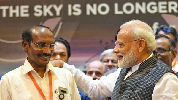 India's Prime Minister Narendra Modi talks to Kailasavadivoo Sivan, chairperson of the Indian Space Research Organization (ISRO) at their headquarters in Bengaluru, India, September 7, 2019.  - Sputnik International