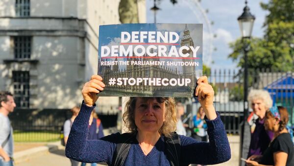 A participant at StopTheCoup rally in London - Sputnik International