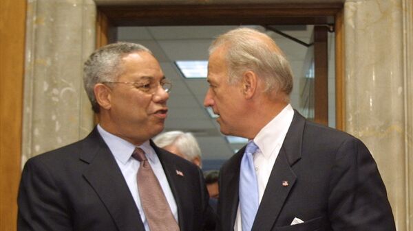 Secretary of State Colin Powell is greeted by Sen. Joseph Biden, D-Del., before Powell testified before a Senate Foreign Relations committee hearing on Iraq Thursday, Sept. 26, 2002, on Capital Hill in Washington. (AP Photo/Terry Ashe) - Sputnik International