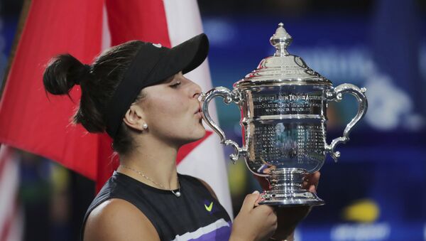 Bianca Andreescu, of Canada, kisses the championship trophy after defeating Serena Williams, of the United States, in the women's singles final of the U.S. Open tennis championships Saturday, Sept. 7, 2019, in New York. - Sputnik International