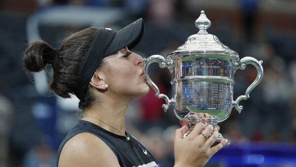 Bianca Andreescu of Canada kisses the championship trophy during the trophy ceremony after her 7 September 2019 match against Serena Williams of the United States (not pictured) in the womenХs final on day thirteen of the 2019 US Open tennis tournament in  Flushing, NY at the USTA Billie Jean King National Tennis Center.  - Sputnik International