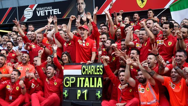 Ferrari's Charles Leclerc celebrates winning the race with teammates.  - Sputnik International