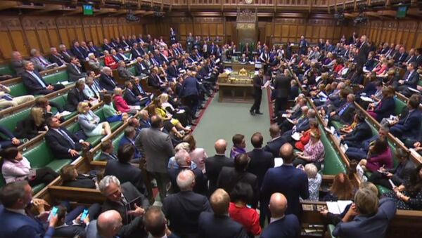 A video grab from footage broadcast by the UK Parliament's Parliamentary Recording Unit (PRU) shows MPs filing back into the House after voting on the third reading of the European Union Withdrawal No 6 Bill, a bill to delay Brexit for three months, in the House of Commons in London on September 4, 2019 - Sputnik International