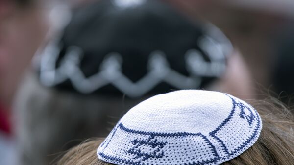 People of different faiths wear the Jewish kippah during a demonstration against antisemitism in Germany in Erfurt, Germany, Wednesday, April 25, 2018. - Sputnik International