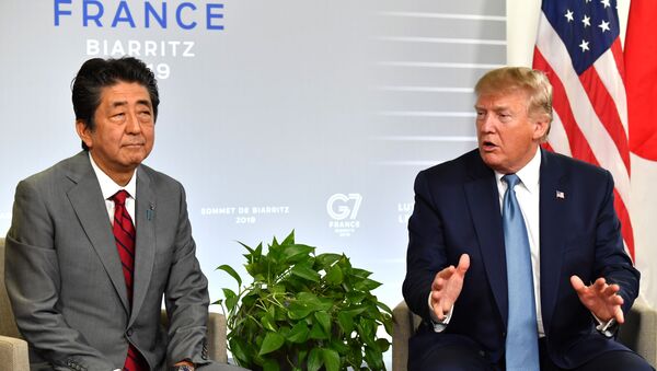 Japan's Prime Minister Shinzo Abe (L) listens to US President Donald Trump during a bilateral meeting on the sidelines of the G7 summit in Biarritz, south-west France on August 25, 2019, - Sputnik International