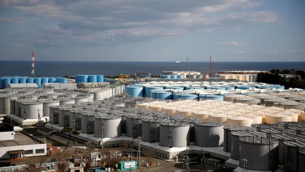 FILE PHOTO: Storage tanks for radioactive water are seen at Tokyo Electric Power Co's (TEPCO) tsunami-crippled Fukushima Daiichi nuclear power plant in Okuma town, Fukushima prefecture, Japan February 18, 2019 - Sputnik International
