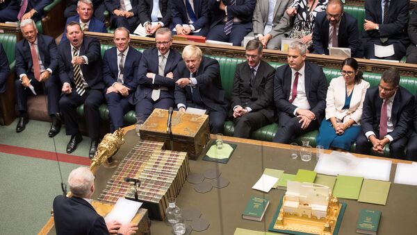 Britain's Prime Minister Boris Johnson gestures as leader of the opposition Labour Party Jeremy Corbyn (bottom) speaks in the House of Commons in London, Britain September 3, 2019 - Sputnik International