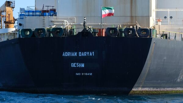 An Iranian flag flutters on board the Adrian Darya oil tanker, formerly known as Grace 1, off the coast of Gibraltar on August 18, 2019 - Sputnik International