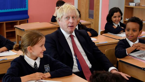 Britain's Prime Minister Boris Johnson attends a class during his visit to Pimlico Primary school in London on September 10, 2019 - Sputnik International