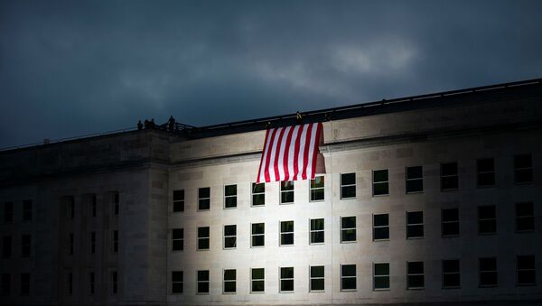 The U.S. flag is unfurled at sunrise as part of the 18th annual September 11 observance ceremony at the Pentagon in Arlington, Virginia, U.S., September 11, 2019. - Sputnik International