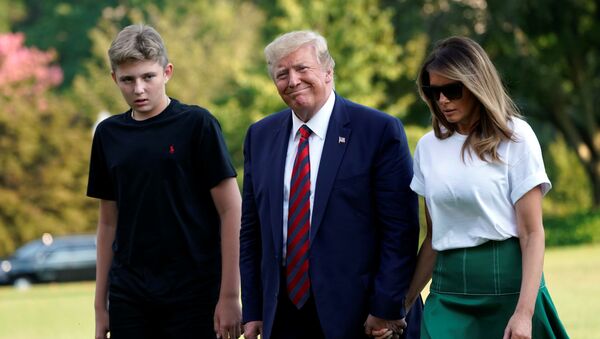 U.S. President Donald Trump with First Lady Melania Trump and their son Barron walk on the South Lawn of the White House upon their return to Washington from Bedminster, New Jersey, U.S., August 18, 2019 - Sputnik International