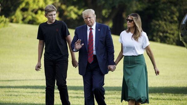 President Donald Trump, first lady Melania Trump and their son Barron Trump arrive at the White House in Washington, Sunday, Aug. 18, 2019, as they return from Bedminster, N.J.  - Sputnik International
